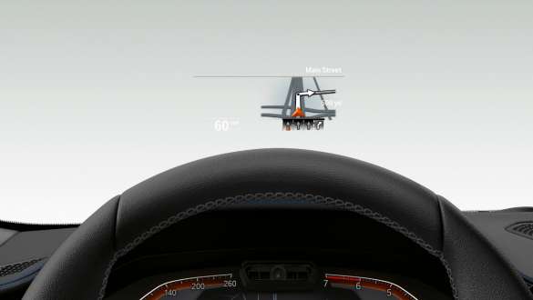Frontal close-up of half the steering wheel and windscreen of the BMW 3 Series Sedan with BMW Head-Up Display.